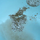 close-up of clay powder added to water